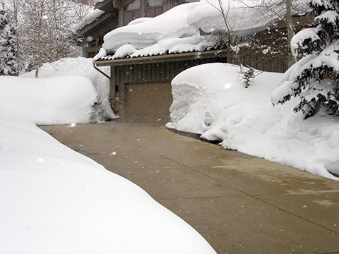 A heated driveway after a large storm in the mountains. A heated driveway installed at a mountain home.