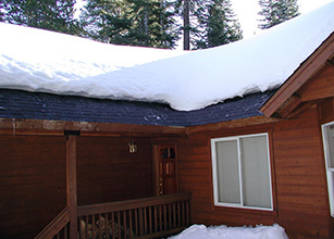Mountain cabin with roof deicing system.